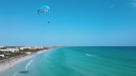 parasailing over the clear blue waters of tunisia