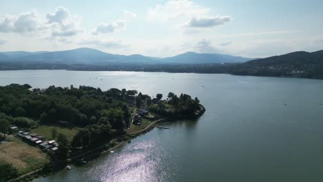 Landscape-of-majestic-Zywiec-lake-in-Beskid-mountains---aerial-view-shoreline-and-mountains-outline-4K