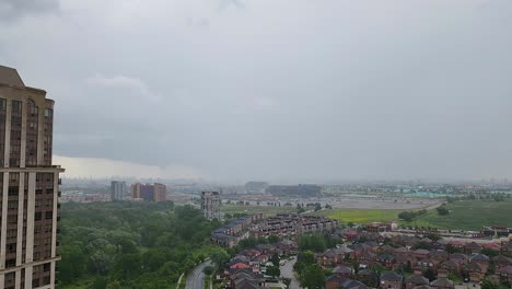 Time-Lapse-of-Gustnado-moving-over-Toronto,-Cloud-wall-moving-along-cityscape