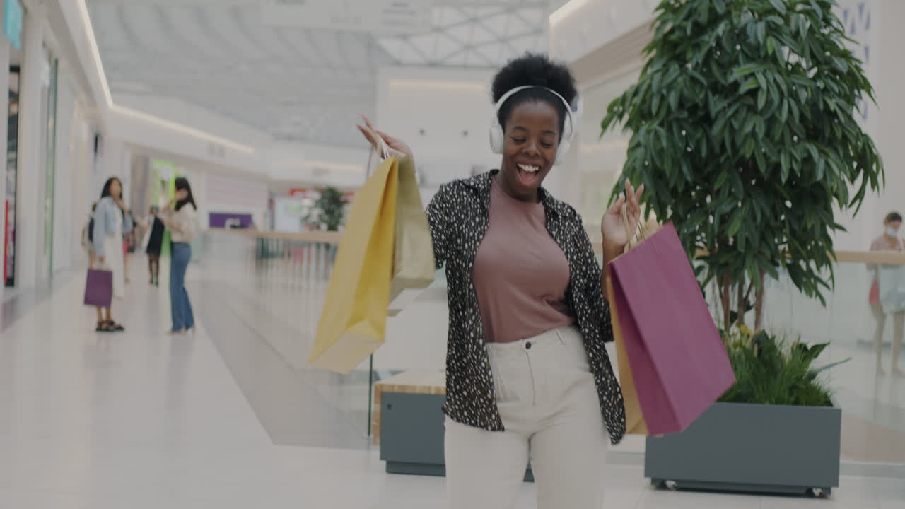 Happy Woman Shopping in a Mall