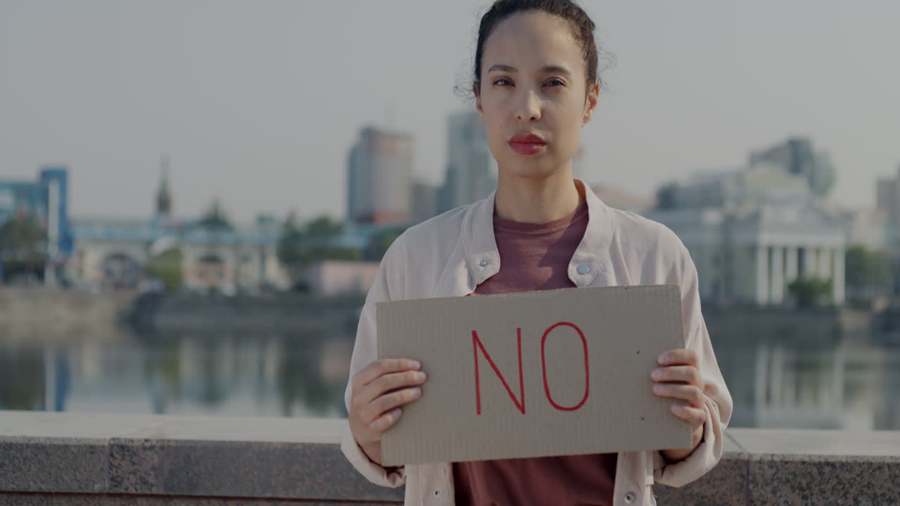 Woman Holding a "No" Sign