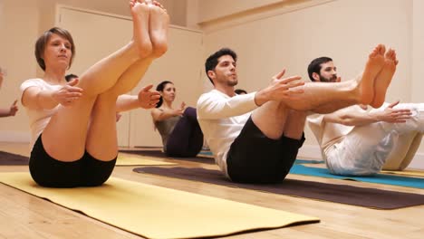 group of people performing yoga