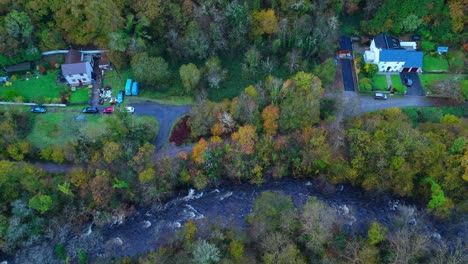 traditional farmhouses built near the river cascading over the rocks brecon beacons