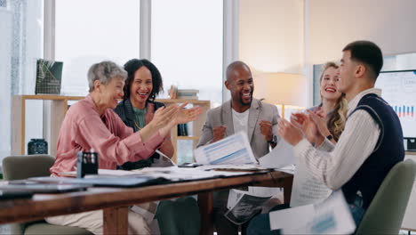 business team celebrates success at a meeting