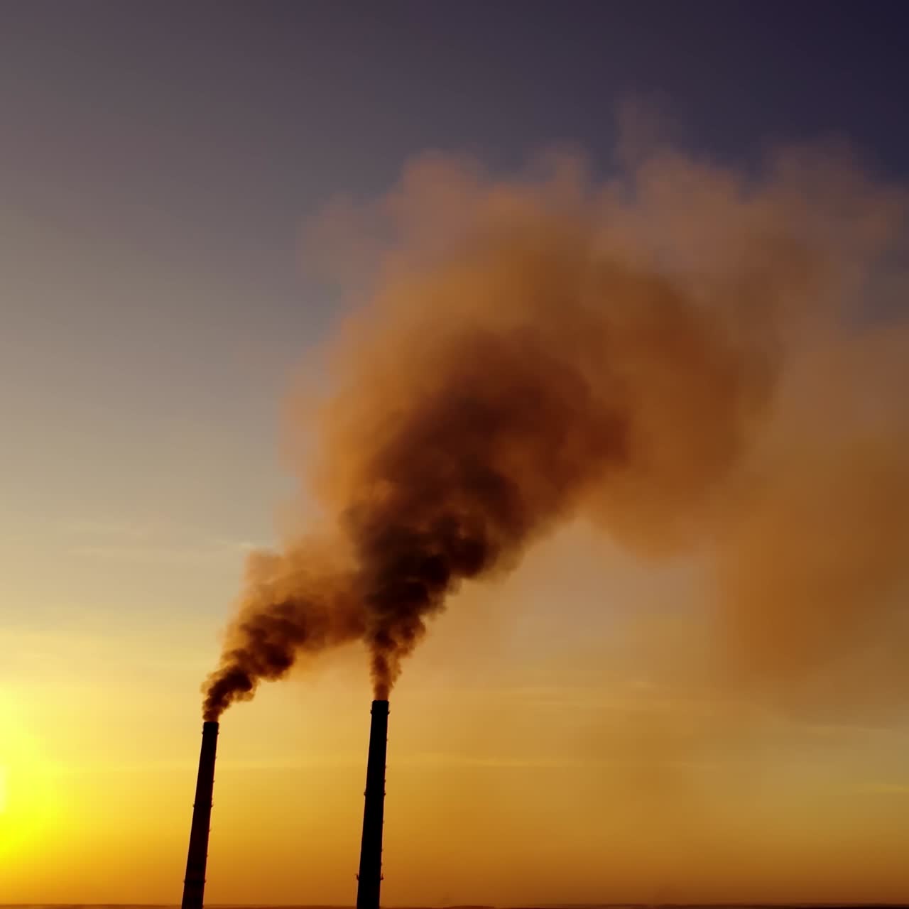 Aerial view of smoke from chimneys