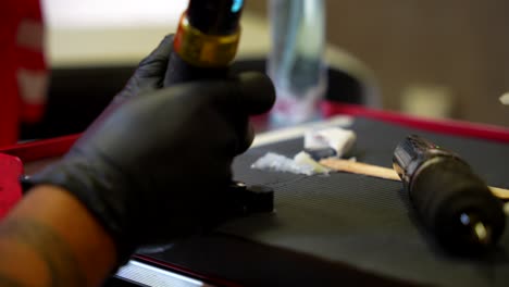 close-up of tattoo artist's workstation and supplies