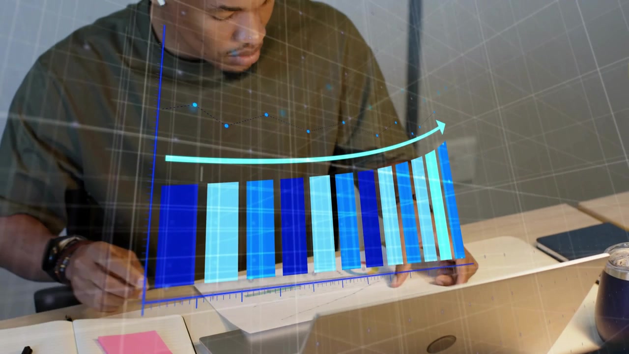 Vertical video: Analyst writing notes then blue bar chart rising above laptop, reviewing finance