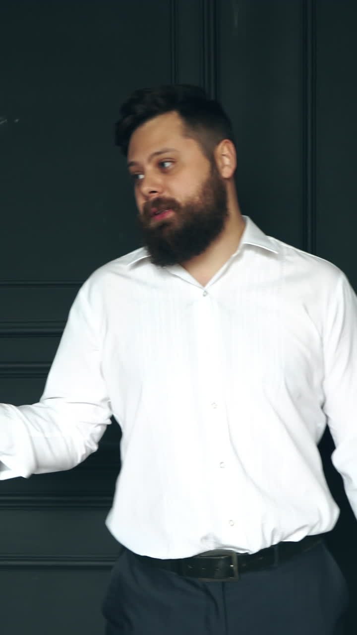 Brutal man in studio. Young casual bearded man posing in studio
