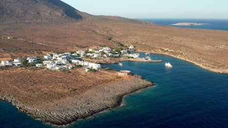 Ship-anchored-in-Avlemonas-Pass-at-sunset,-Greece