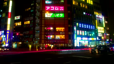 night lapse with many japanese neons at shinjuku south side right panning