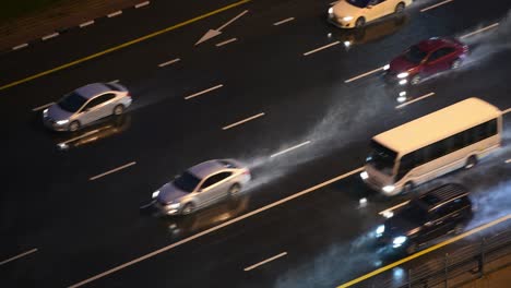 cars driving on the highway during heavy rain in dubai