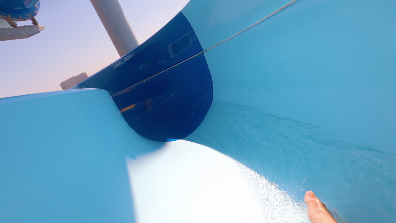 Woman sliding down a ride at a water park