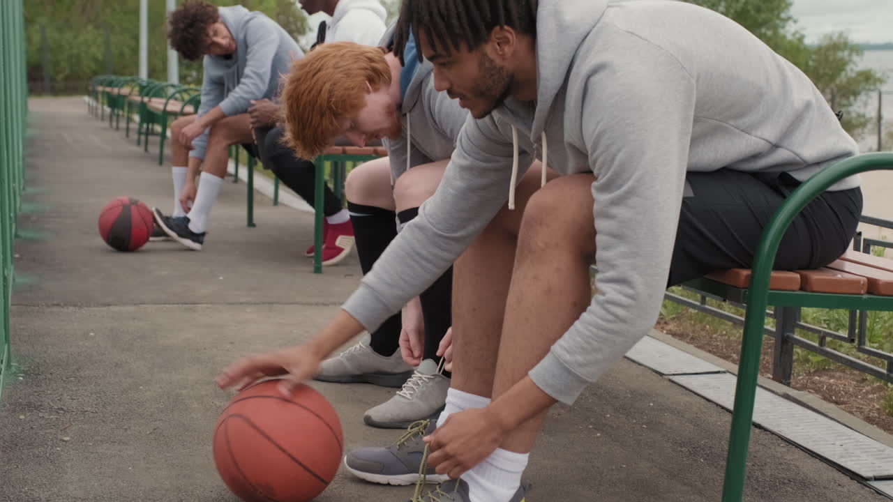 Men Resting after Basketball Game