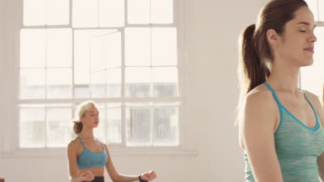 Yoga-class-multi-racial-group-of-women-exercising-fitness-healthy-lifestyle