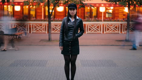 woman in black outfit in a city cafe