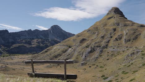 rustic wooden bench viewpoint looking at stožina peak in montenegro