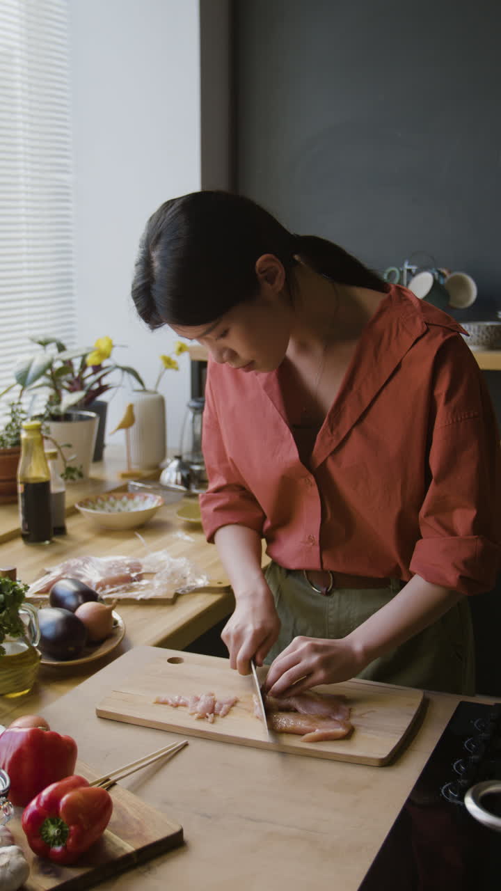 Woman Cooking in Kitchen: Cutting Chicken and Vegetables