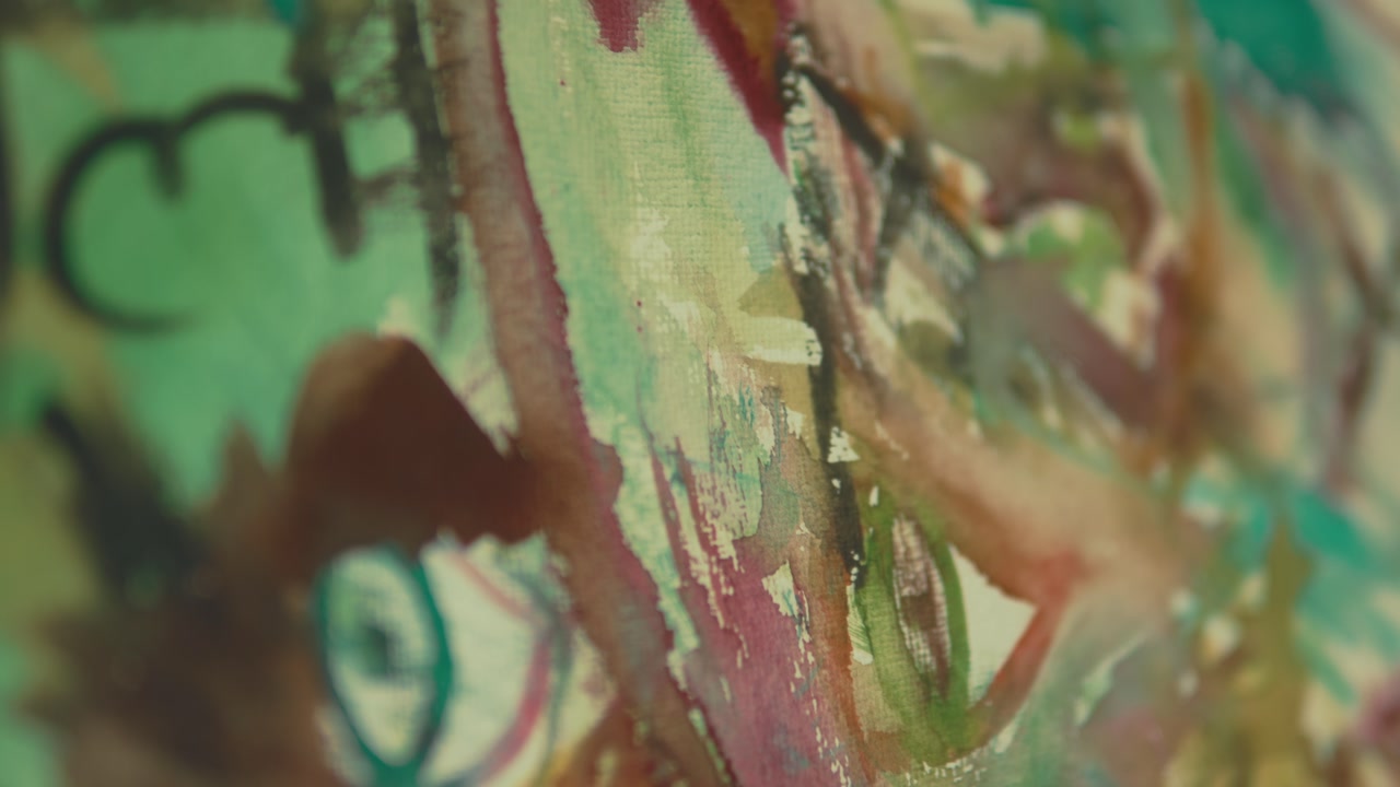 Close up of a colorful abstract painting showing layered brush strokes and mixed textures. Artistic surface with vibrant colors and expressive details.