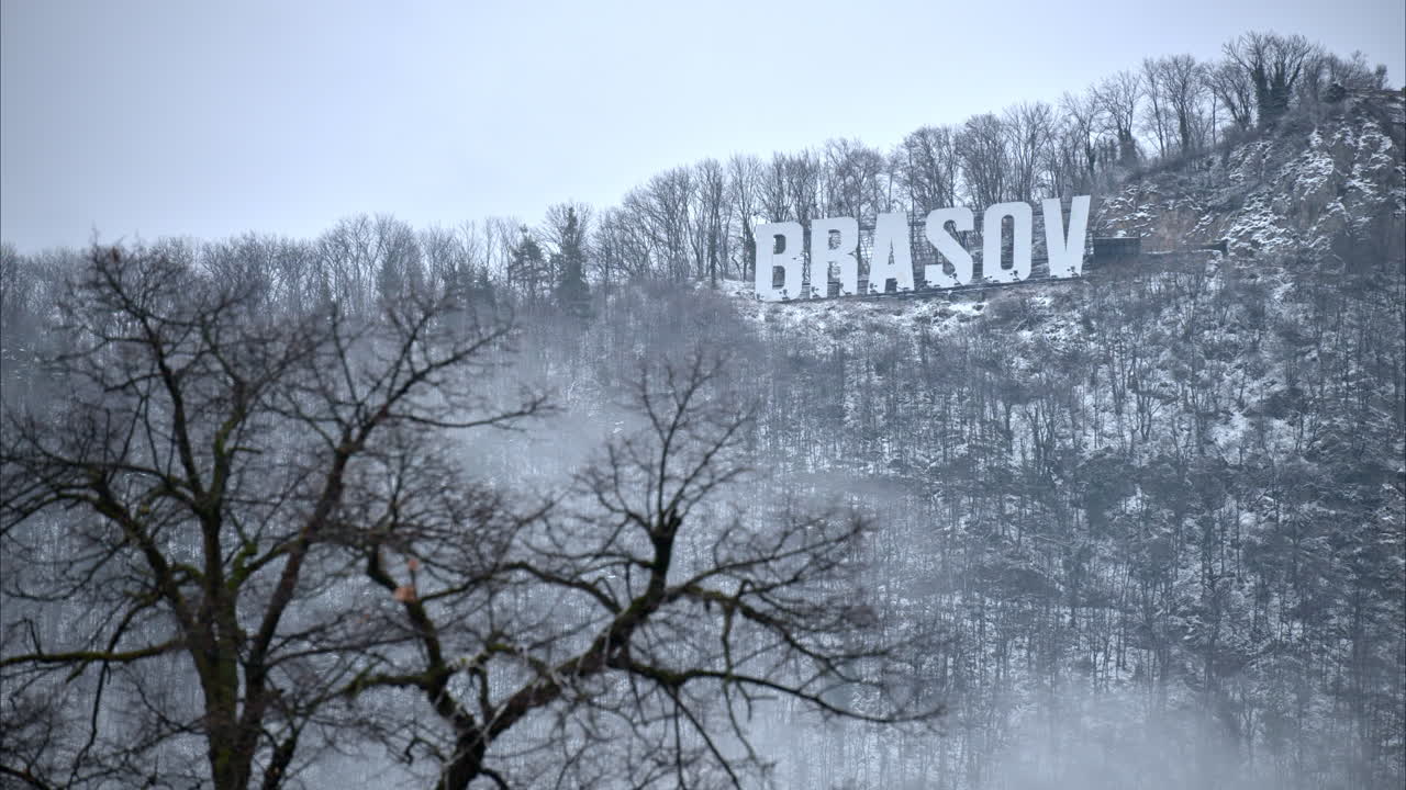 Brasov writing on the top of the Tampa mountain in the snow