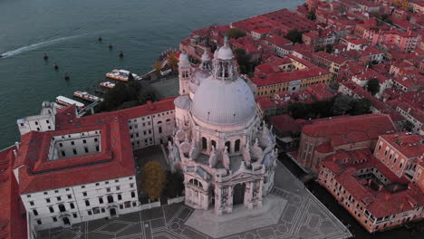 aerial view of santa maria della salute at sunrise in venice, italy