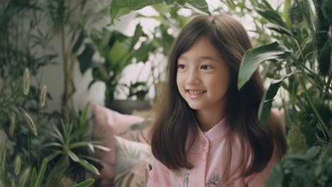 smiling girl surrounded by plants