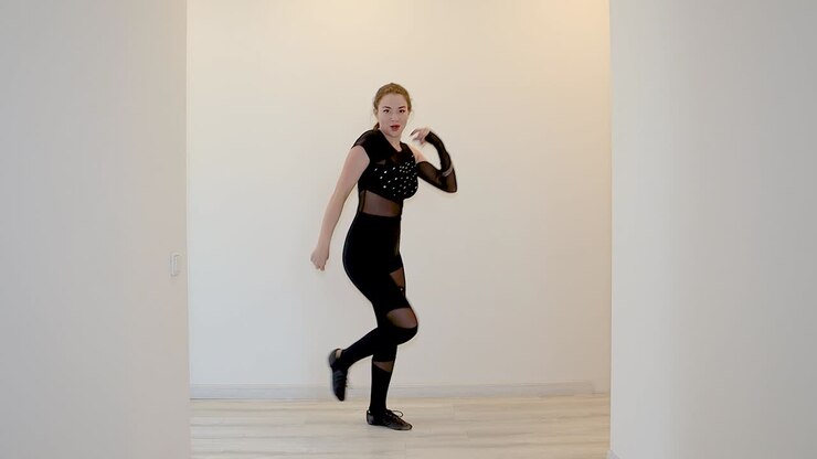 Slow motion Caucasian female dance performance indoors
