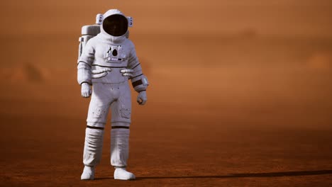astronauta en la superficie de marte. planeta rojo cubierto de gas y roca