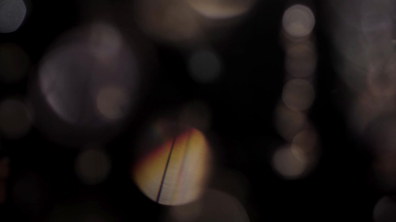 Abstract Bokeh Light Orbs Moving on Dark Background
