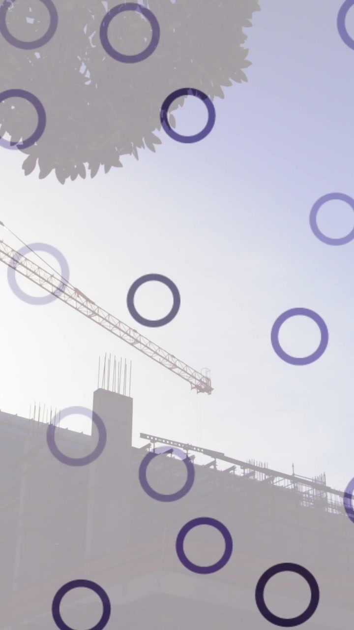 Animation of falling circles over construction site