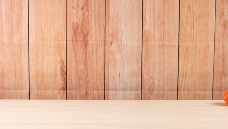 a tennis ball moves across a wooden shelf