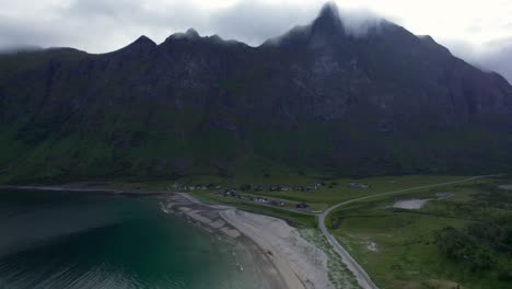 Flying-backwards-over-Ersfjord-Beach-on-Senja-on-a-moody-day-during-summer