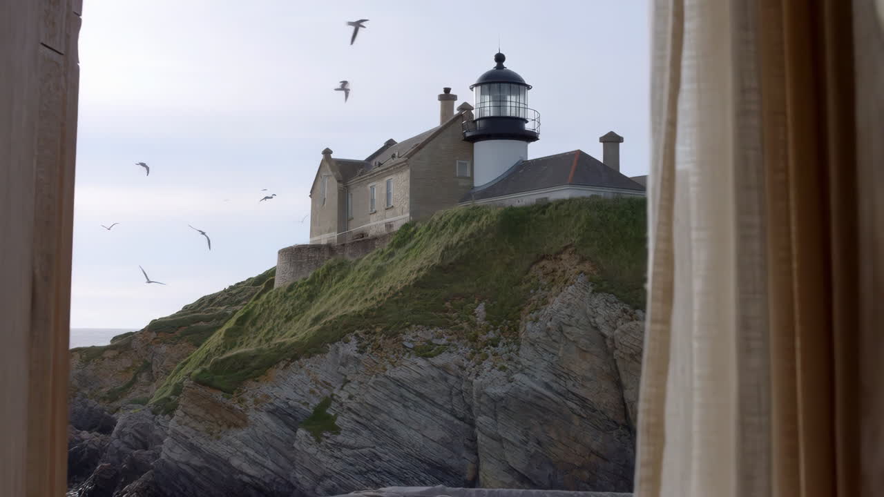 Lighthouse on a Cliff Viewed from a Window