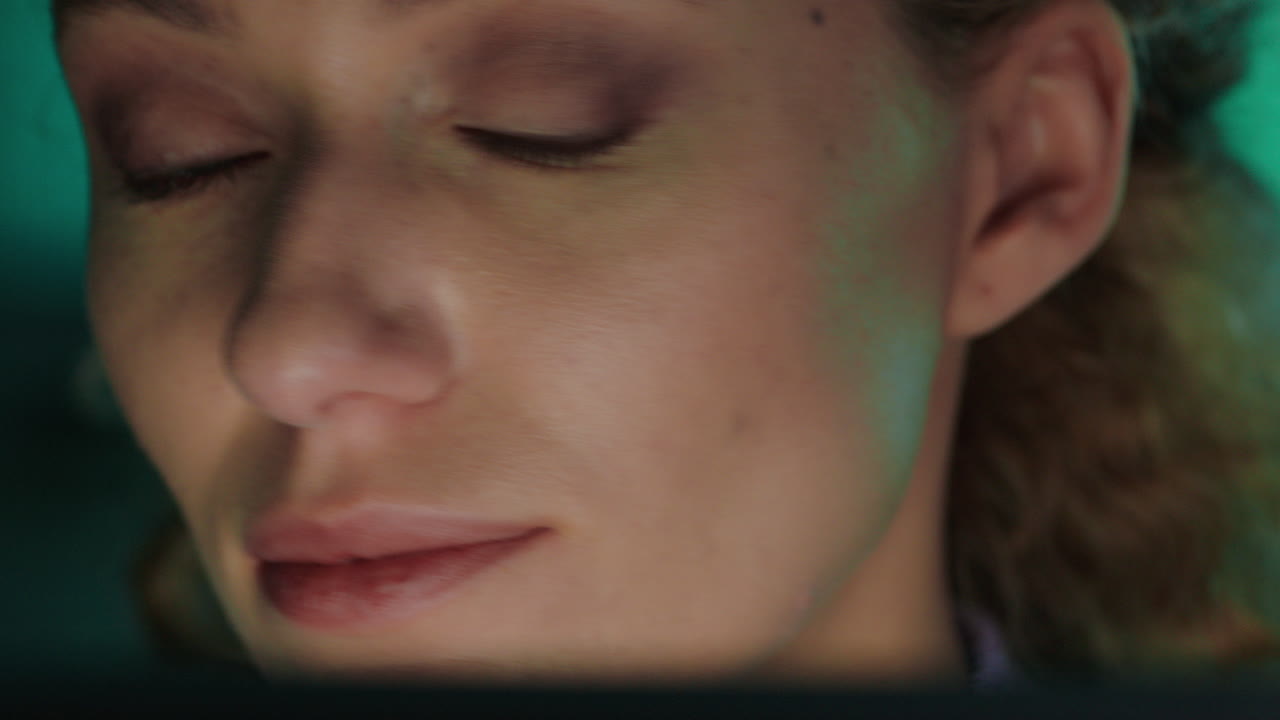 close up portrait beautiful woman using tablet computer working late browsing internet looking at screen enjoying online communication