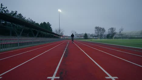 man training on a running track