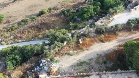aerial view over countryside with dolly back over hilltop tal virtu castle located in rabat, malta