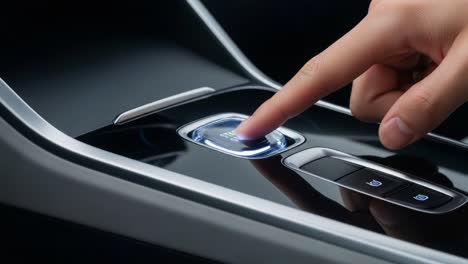 a close-up of a futuristic vehicle control panel featuring the ignition button activated by a finger touch, highlighting modern automotive technology