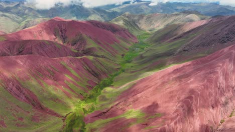 Aerial-fly-drone-view-of-Rainbow-Mountain-,-Vinicunca,-Cusco-Region,-Peru