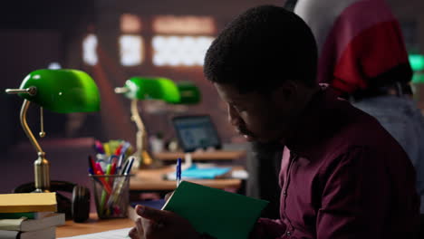 vertical video african american guy studies for a critical law exam and reading specialty books