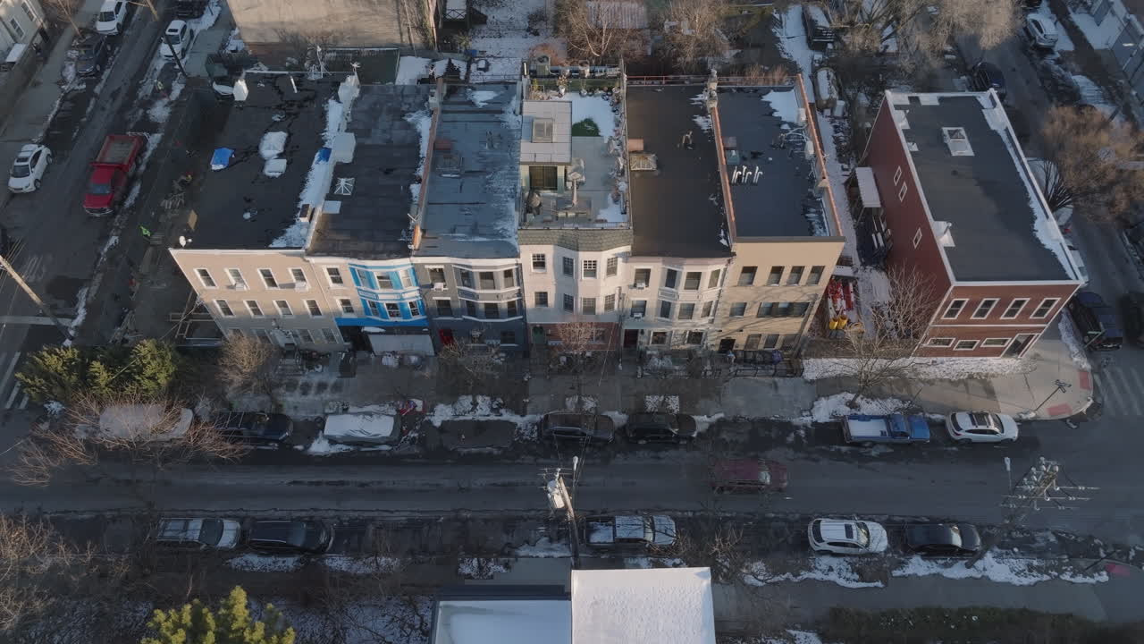 Establishing shot of a row of houses in Brooklyn. Shot on a winter afternoon in New York City