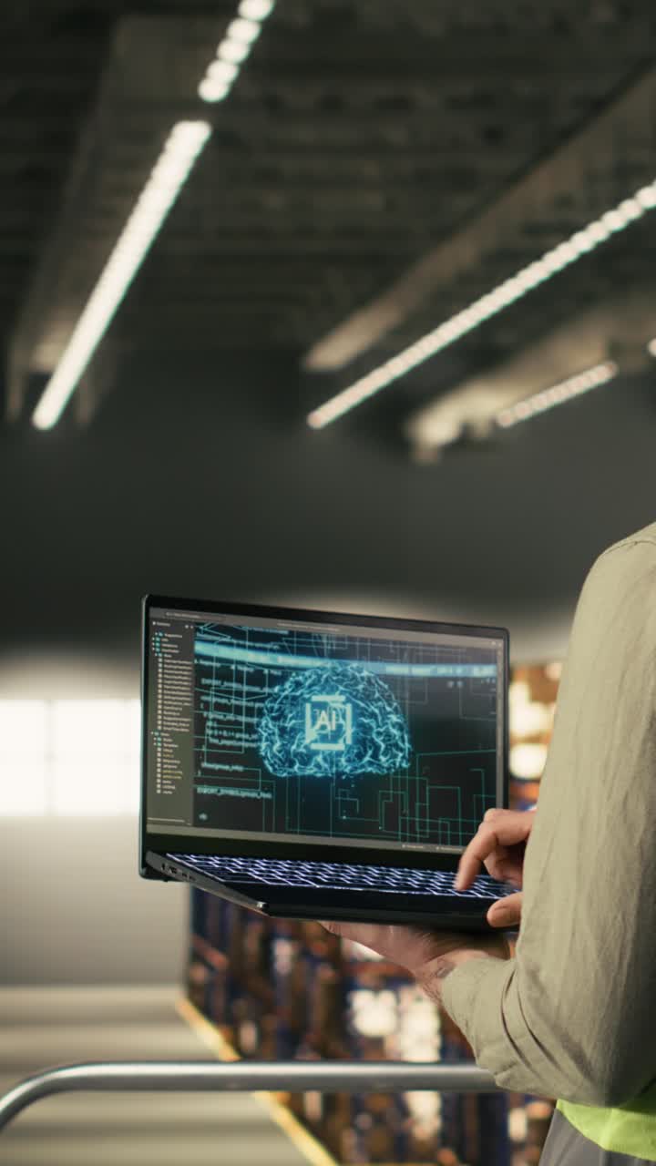 Vertical Video Industrial worker using AI-powered software with machine learning on laptop