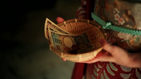 offering money in a kimono