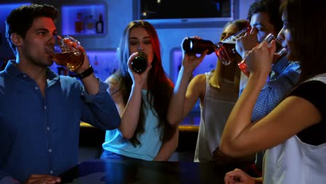 Friends-toasting-beer-glasses-in-the-bar