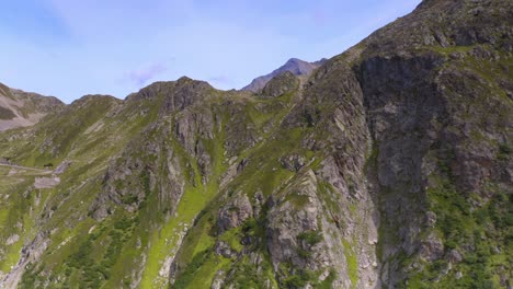 aerial drone flying across switzerland mountain pass road