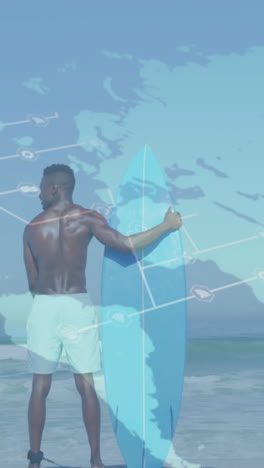 animación del mapa del mundo sobre la vista trasera de un hombre afroamericano sosteniendo una tabla de surf en la playa