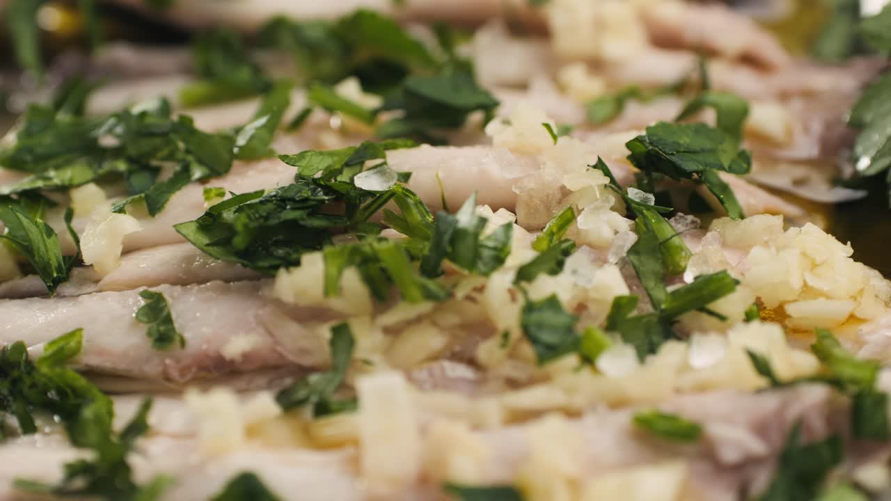 Fresh Sea sardines and Anchovy Fish and Mullus On Display On Ice On Market Store Shop. Seafood Fish Background, close up stand of small salty white fish.