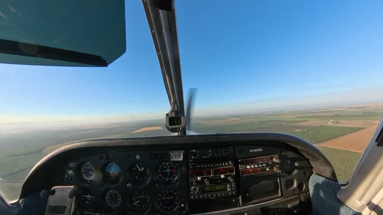 Golden hour flight in a general aviation aircraft over Northern California’s fields. Stunning rural terrain meets vibrant skies in this scenic sunset captured from above