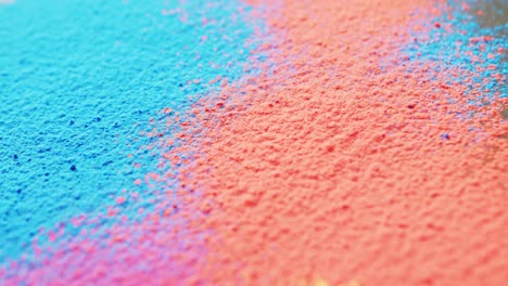 video of close up of multi coloured powders with copy space