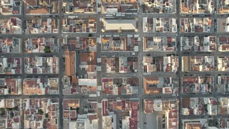 aerial topdown view along symmetrical urban grid towards vila real de santo antonio marina in portugal