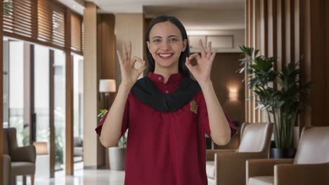 Happy-Indian-female-housekeeper-showing-okay-sign