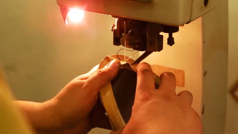 Cobbler-using-sewing-machine